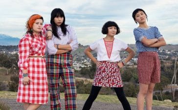 The Linda Linda band standing on rocks