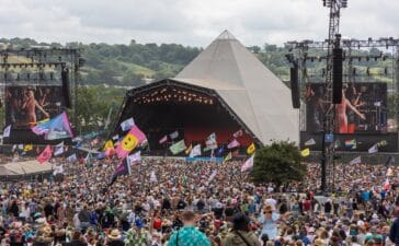 Glastonbury Festival 2024 - Day Five GLASTONBURY, ENGLAND - JUNE 30: People gather in front of the main Pyramid Stage during day five of Glastonbury Festival 2024 at Worthy Farm, Pilton on June 30, 2024 in Glastonbury, England. Founded by Michael Eavis in 1970, Glastonbury Festival features around 3,000 performances across over 80 stages. Renowned for its vibrant atmosphere and iconic Pyramid Stage, the festival offers a diverse lineup of music and arts, embodying a spirit of community, creativity, and environmental consciousness. The Glastonbury Festival is set to return in June 2025, before having a fallow year in 2026. (Photo by Matt Cardy/Getty Images)