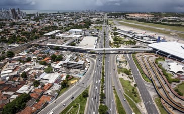 Aerial view of Recife showing major roads, railway lines, neighbourhoods and the airport.