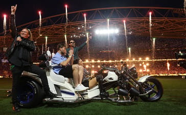 Amy Shark, Dave Gleeson and Phil Jamieson performing with Jai Arrow and Nathan Charles before the 2026 NRL Grand Final