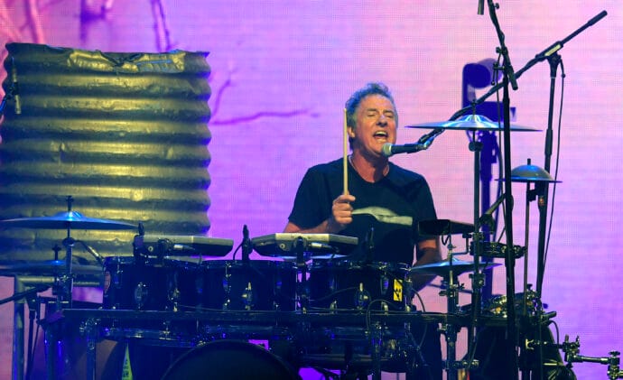Midnight Oil’s Rob Hirst Reveals Cancer Battle: “I’ve Had Pretty Much Every Treatment Known to Man”