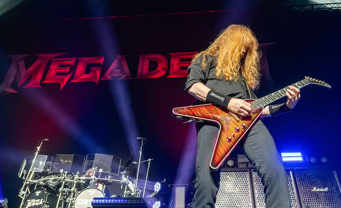 Megadeth performing live on stage.