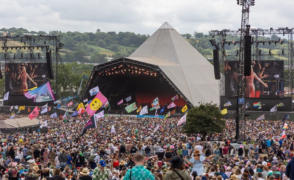 Glastonbury Festival 2024 - Day Five GLASTONBURY, ENGLAND - JUNE 30: People gather in front of the main Pyramid Stage during day five of Glastonbury Festival 2024 at Worthy Farm, Pilton on June 30, 2024 in Glastonbury, England. Founded by Michael Eavis in 1970, Glastonbury Festival features around 3,000 performances across over 80 stages. Renowned for its vibrant atmosphere and iconic Pyramid Stage, the festival offers a diverse lineup of music and arts, embodying a spirit of community, creativity, and environmental consciousness. The Glastonbury Festival is set to return in June 2025, before having a fallow year in 2026. (Photo by Matt Cardy/Getty Images)
