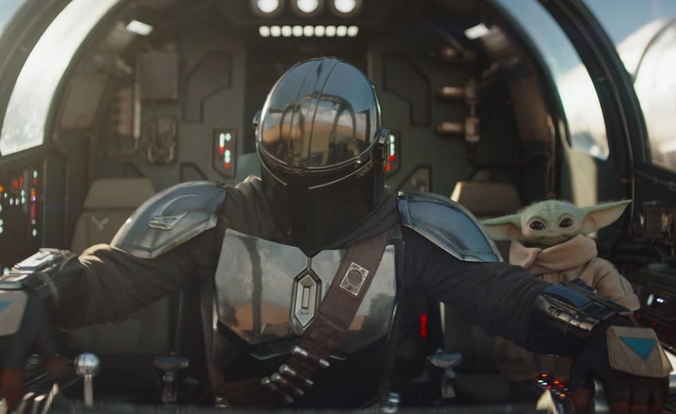 (L-R) Mandalorian (Pedro Pascal) and Grogu in Lucasfilm's THE MANDALORIAN & GROGU. Photo courtesy of Lucasfilm. © 2025 Lucasfilm Ltd™. All Rights Reserved.