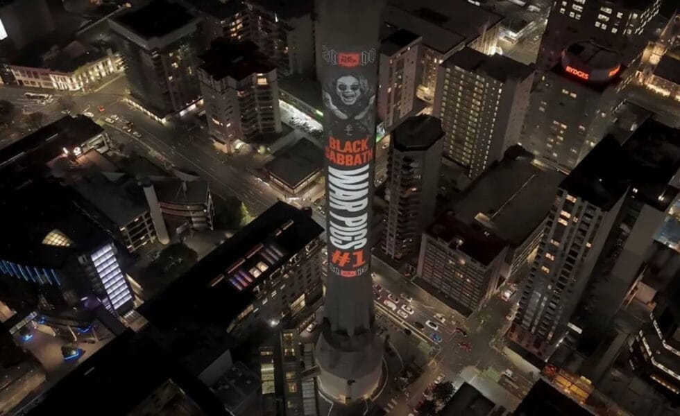 Ozzy Osbourne’s Face Projected on New Zealand’s Sky Tower as ‘War Pigs’ Tops Rock 2000