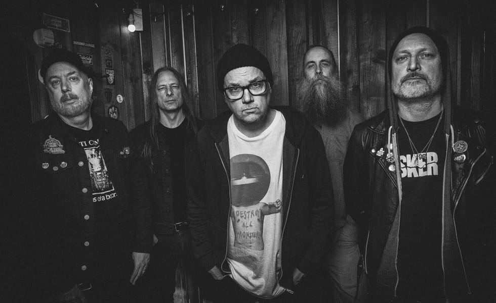 Disfear standing together for a black-and-white band portrait