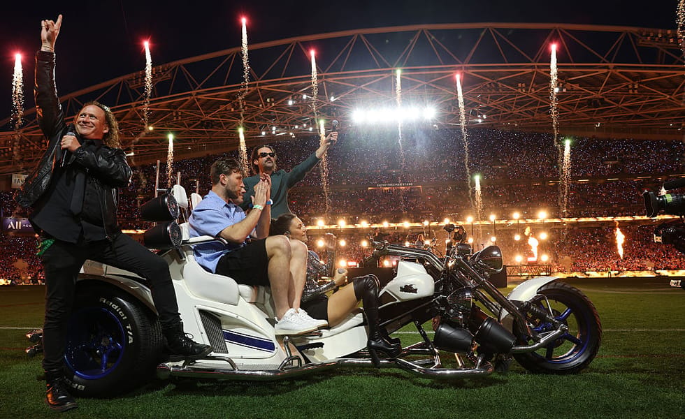 Amy Shark, Dave Gleeson and Phil Jamieson performing with Jai Arrow and Nathan Charles before the 2026 NRL Grand Final