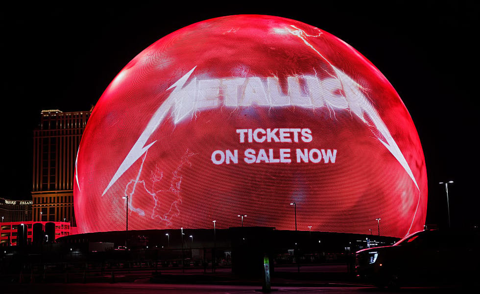 Sphere in Las Vegas displays a red Metallica advertisement at night.