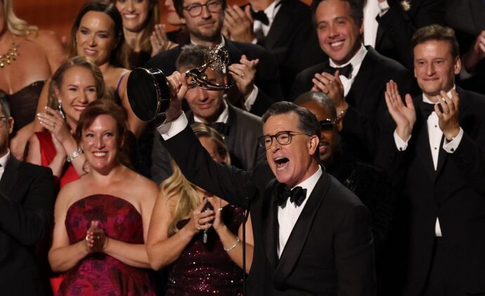 TOPSHOT - US comedian writer Stephen Colbert accepts the Outstanding Talk Series award for "The Late Show with Stephen Colbert" onstage during the 77th Primetime Emmy Awards at the Peacock Theatre at LA Live in Los Angeles on September 14, 2025. (Photo by VALERIE MACON / AFP) / RESTRICTED TO EDITORIAL USE (Photo by VALERIE MACON/AFP via Getty Images)