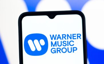 Warner Music Group Settles Lawsuit, Begins Partnership With AI Music Platform Suno