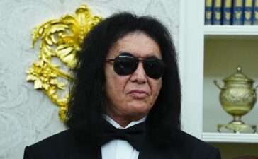 WASHINGTON, DC - DECEMBER 06: Musician Gene Simmons of the rock band KISS looks on during a medal presentation ceremony for the 2025 Kennedy Center Honorees in the Oval Office of the White House on December 06, 2025 in Washington, DC. The 2025 Kennedy Center honorees are Sylvester Stallone, George Strait, the rock band KISS, Gloria Gaynor, and Michael Crawford. (Photo by Aaron Schwartz/Getty Images)